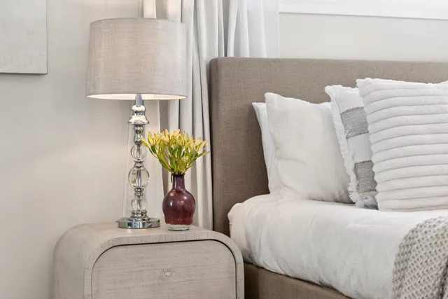 a living room with furniture and flowers