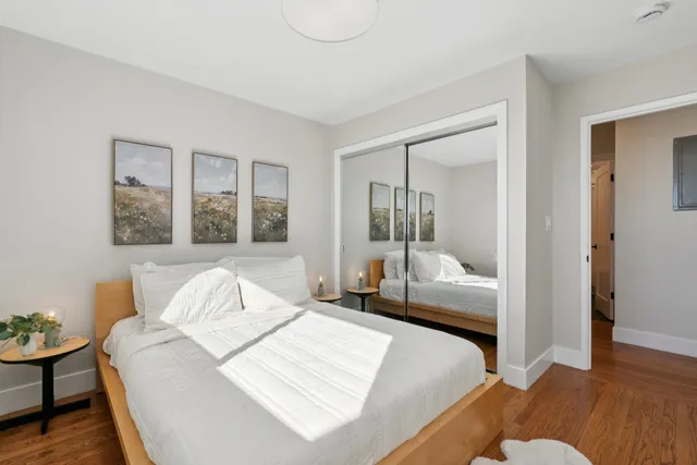 a bedroom with a bed and a couch