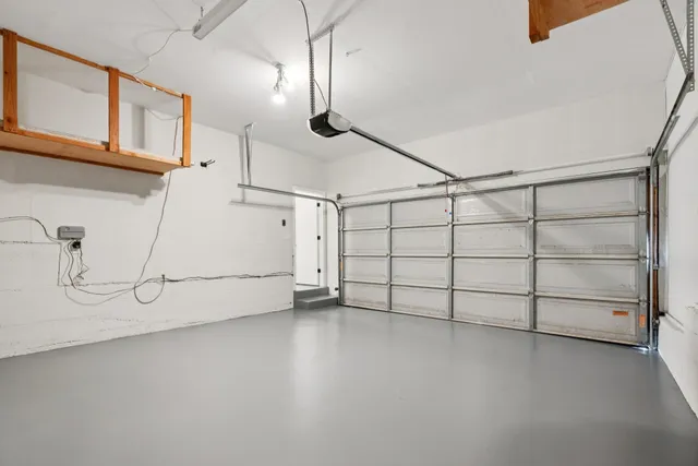 a view of a garage with racks on the wall