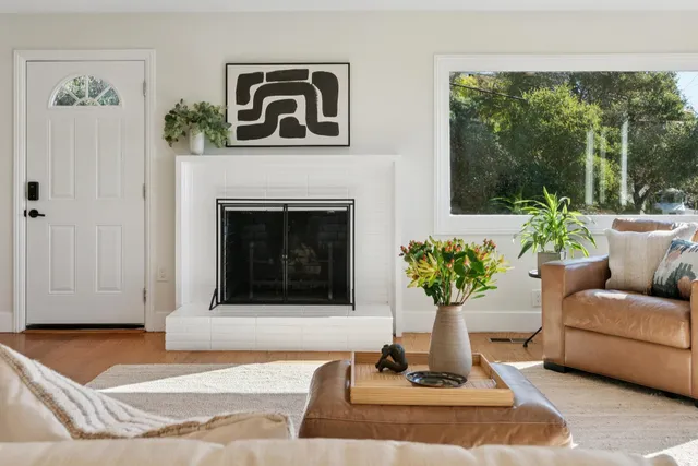 a living room with furniture and a fireplace