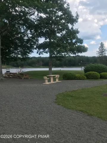 a room with pool table and windows