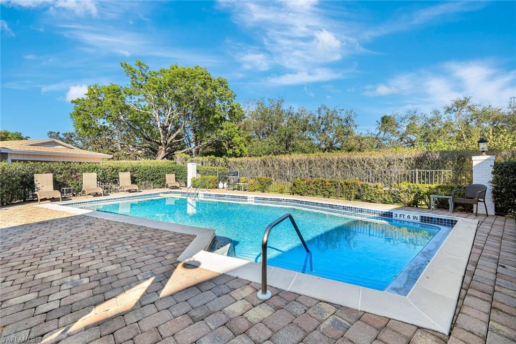3107 Riviera Drive, Unit A202 Naples, FL 34103 - Photo 20 of 25 Just Steps Away - A Glimmering Pool Ready For A Quick After Beach Dip!