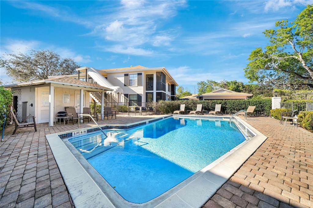 3107 Riviera Drive, Unit A202 Naples, FL 34103 - Photo 21 of 25 Just Steps Away - A Glimmering Pool Ready For A Quick After Beach Dip!