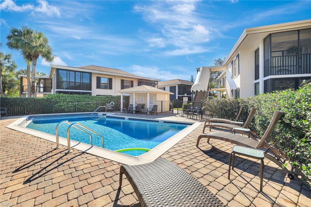 3107 Riviera Drive, Unit A202 Naples, FL 34103 - Photo 22 of 25 Just Steps Away - A Glimmering Pool Ready For A Quick After Beach Dip!