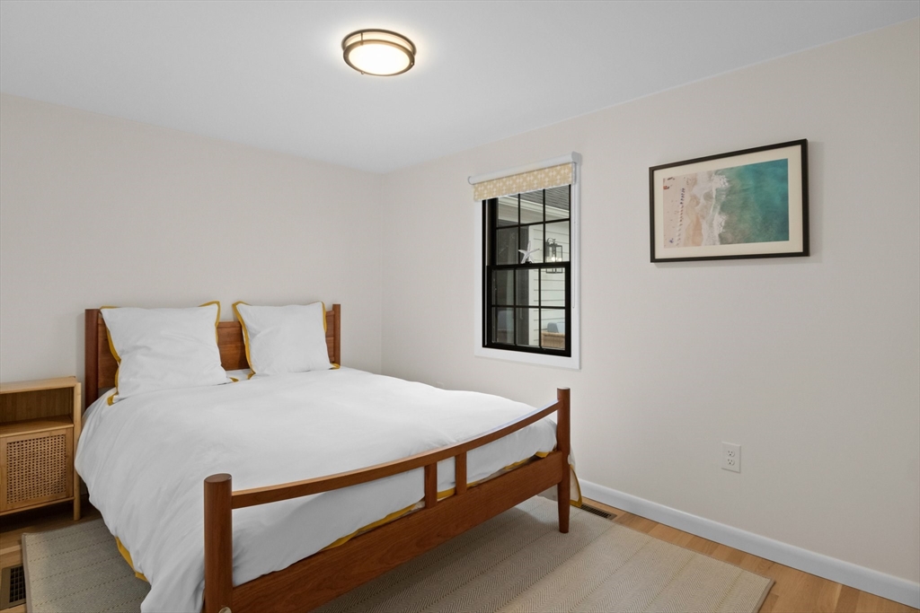 101 Monomoyic Way Chatham, MA 02633 - Photo 11 of 18 a bedroom with a bed and a window