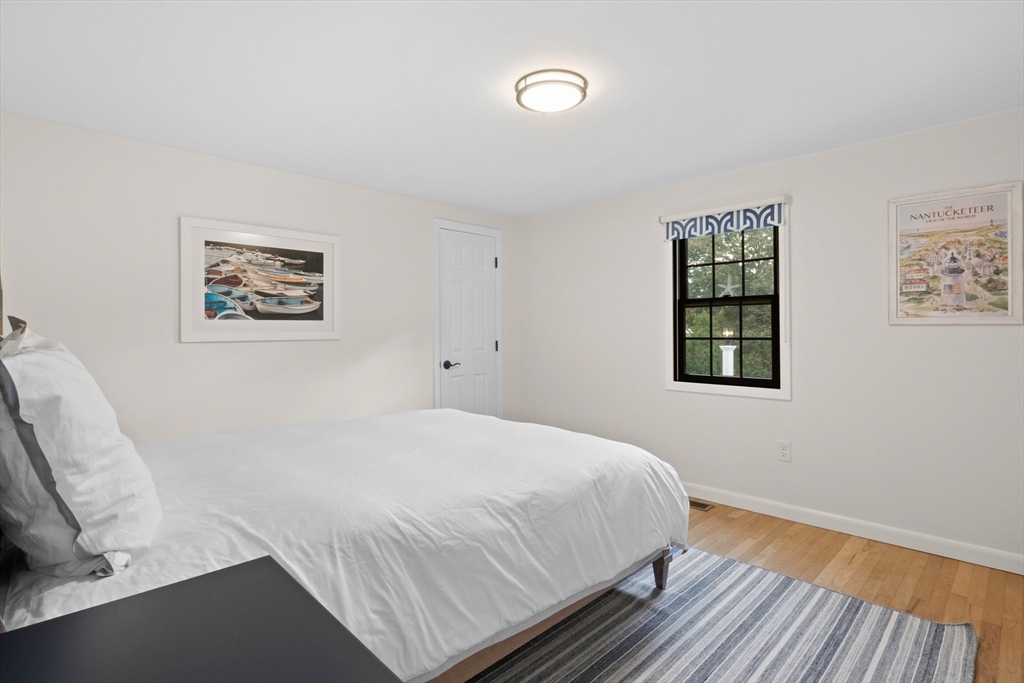 101 Monomoyic Way Chatham, MA 02633 - Photo 9 of 18 a bedroom with a bed and a window