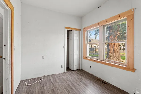 a view of a livingroom with wooden floor