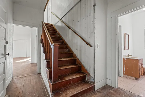 a view of a hallway with a window