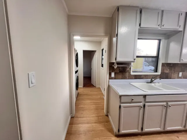 a en suite bathroom with a sink and a mirror