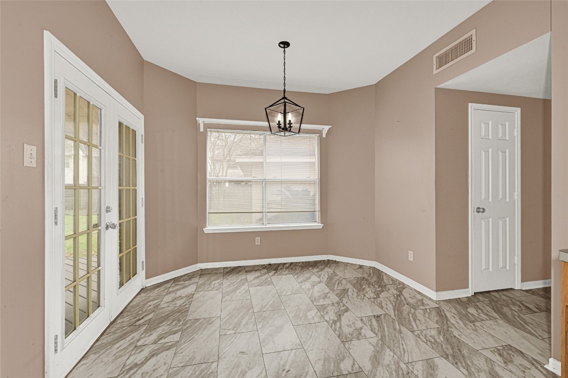 1503 Pine Ridge Lane Pearland, TX 77581 - Photo 12 of 23 a view of empty room with wooden floor and fan