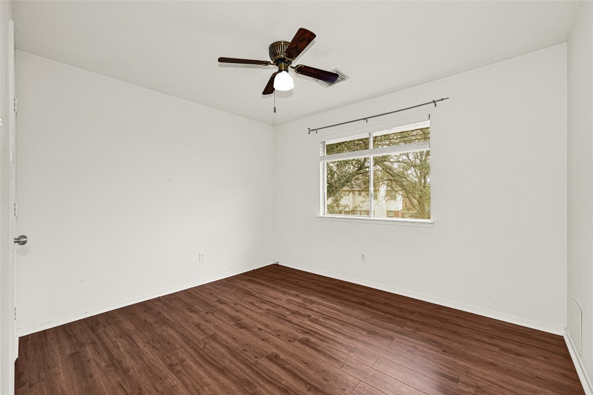 1503 Pine Ridge Lane Pearland, TX 77581 - Photo 15 of 23 a view of empty room with wooden floor and fan