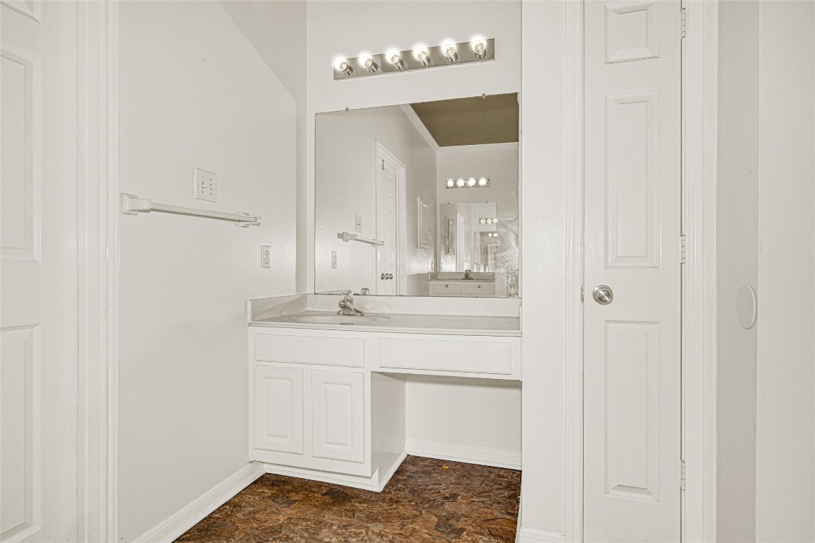 1503 Pine Ridge Lane Pearland, TX 77581 - Photo 19 of 23 a bathroom with a sink and a mirror