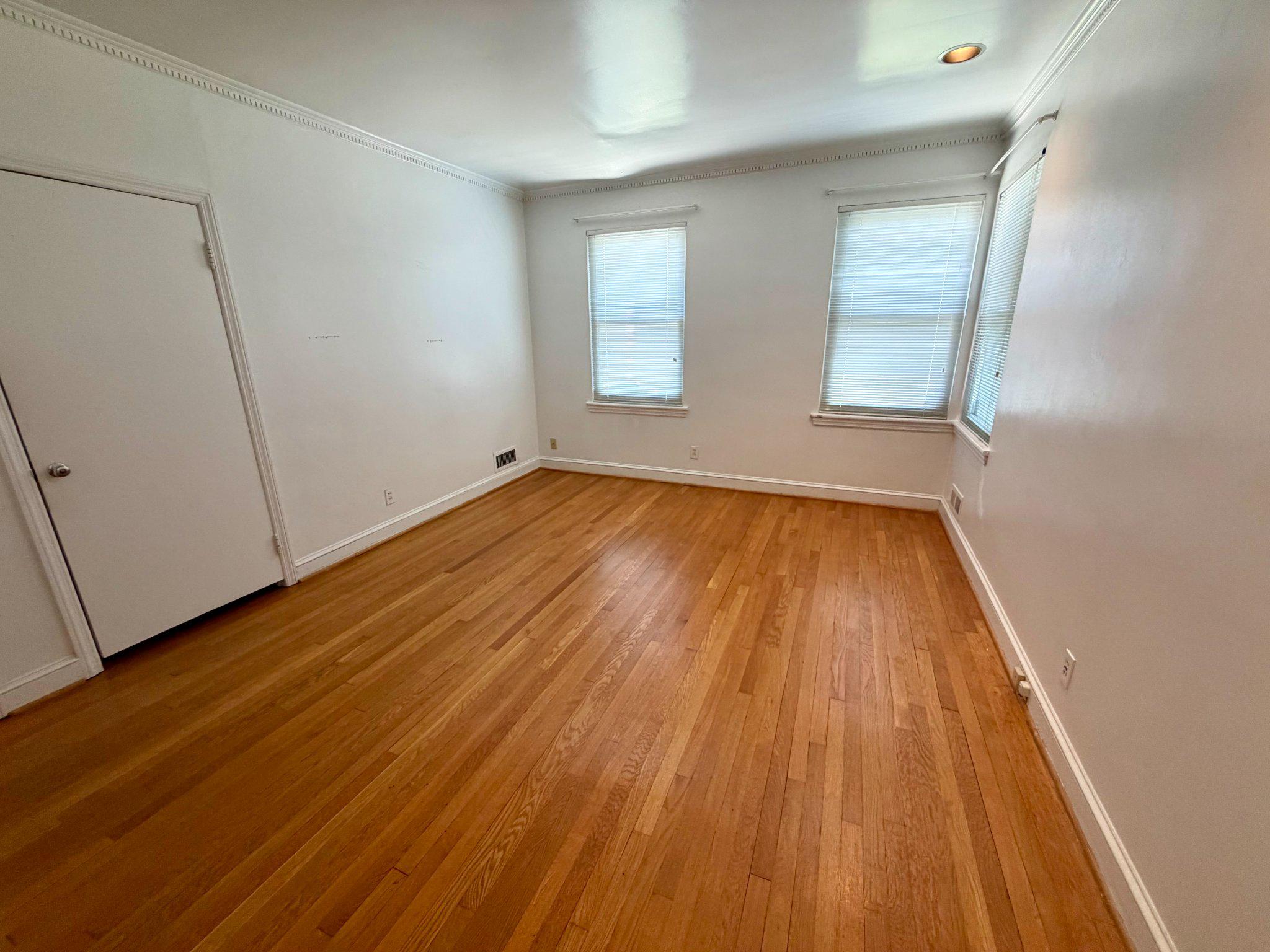 6318 Winner Avenue Baltimore, MD 21215 - Photo 29 of 75 a view of a room with wooden floor and white walls