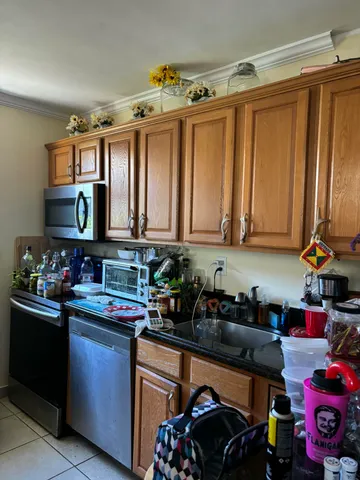 a kitchen with lots of counter top space and cabinets