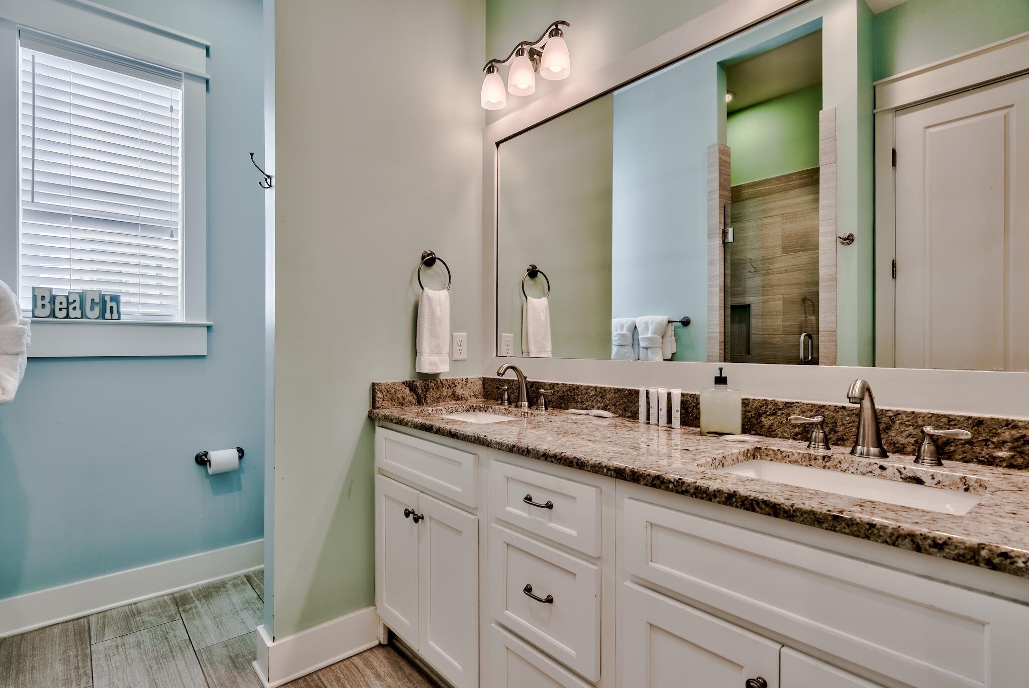 105 Blue Dolphin Loop Inlet Beach, FL 32461 - Photo 12 of 42 a bathroom with a granite countertop sink and a mirror