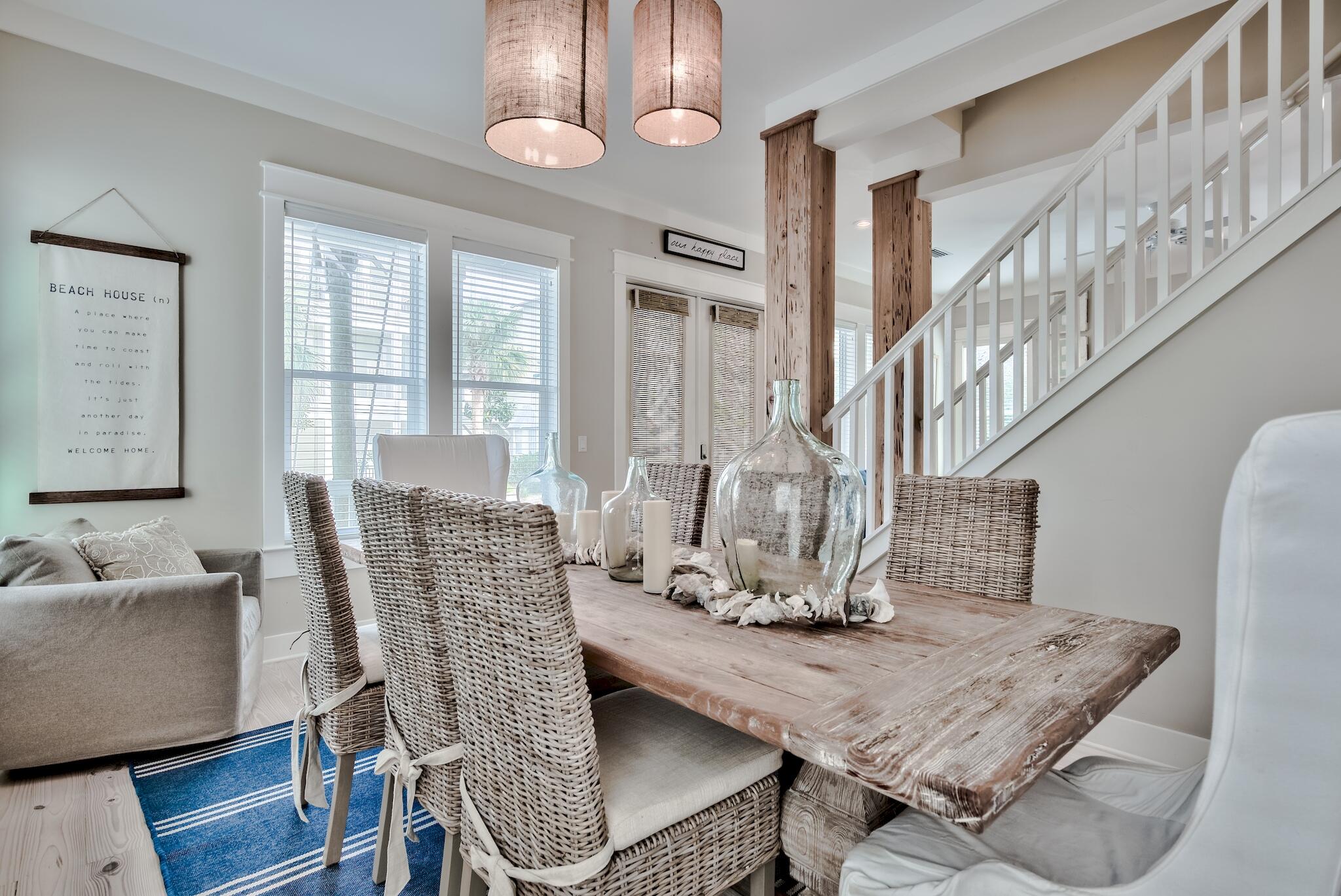 105 Blue Dolphin Loop Inlet Beach, FL 32461 - Photo 14 of 42 a dining room with furniture a chandelier and wooden floor