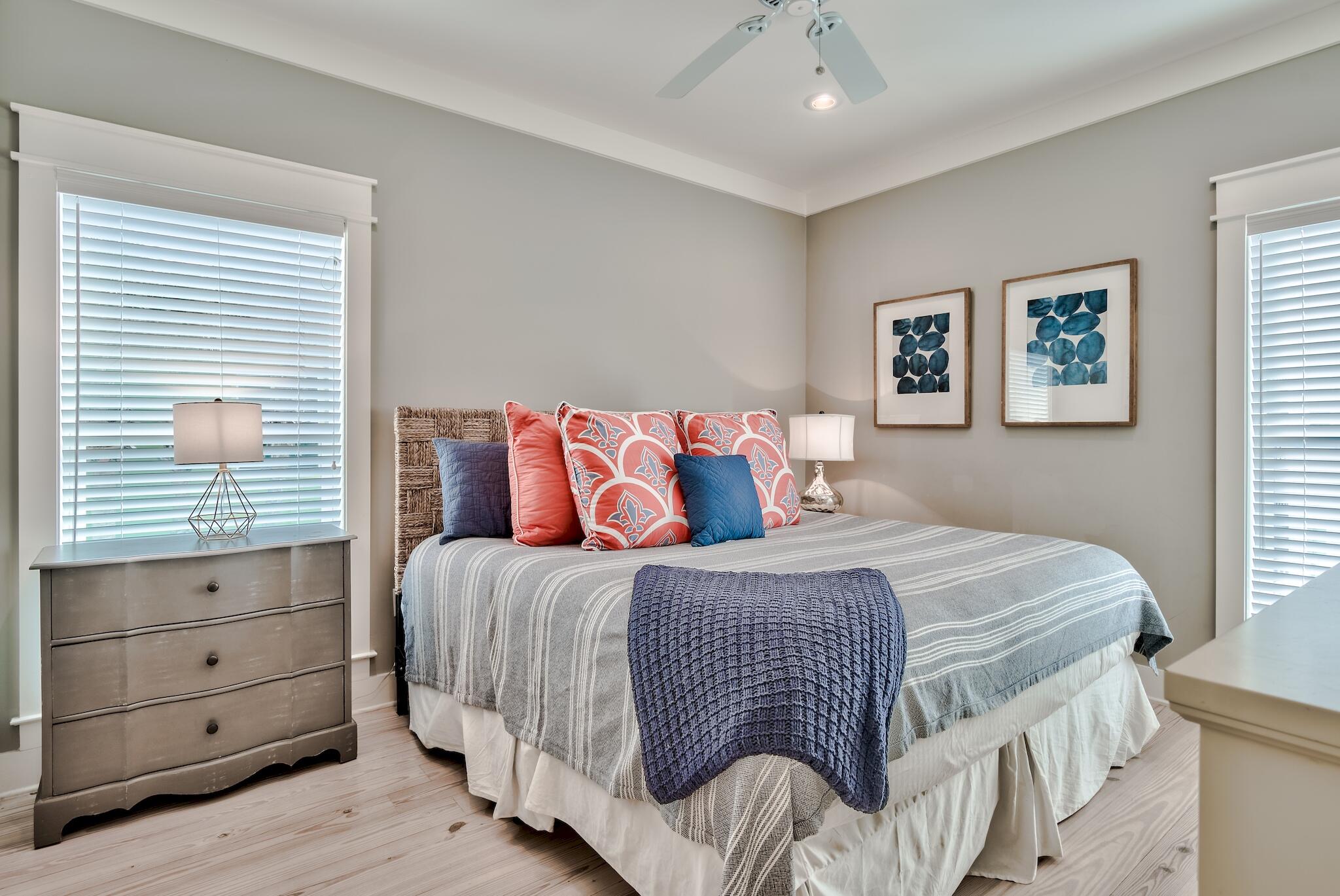 105 Blue Dolphin Loop Inlet Beach, FL 32461 - Photo 16 of 42 a bedroom with a bed and wooden floor