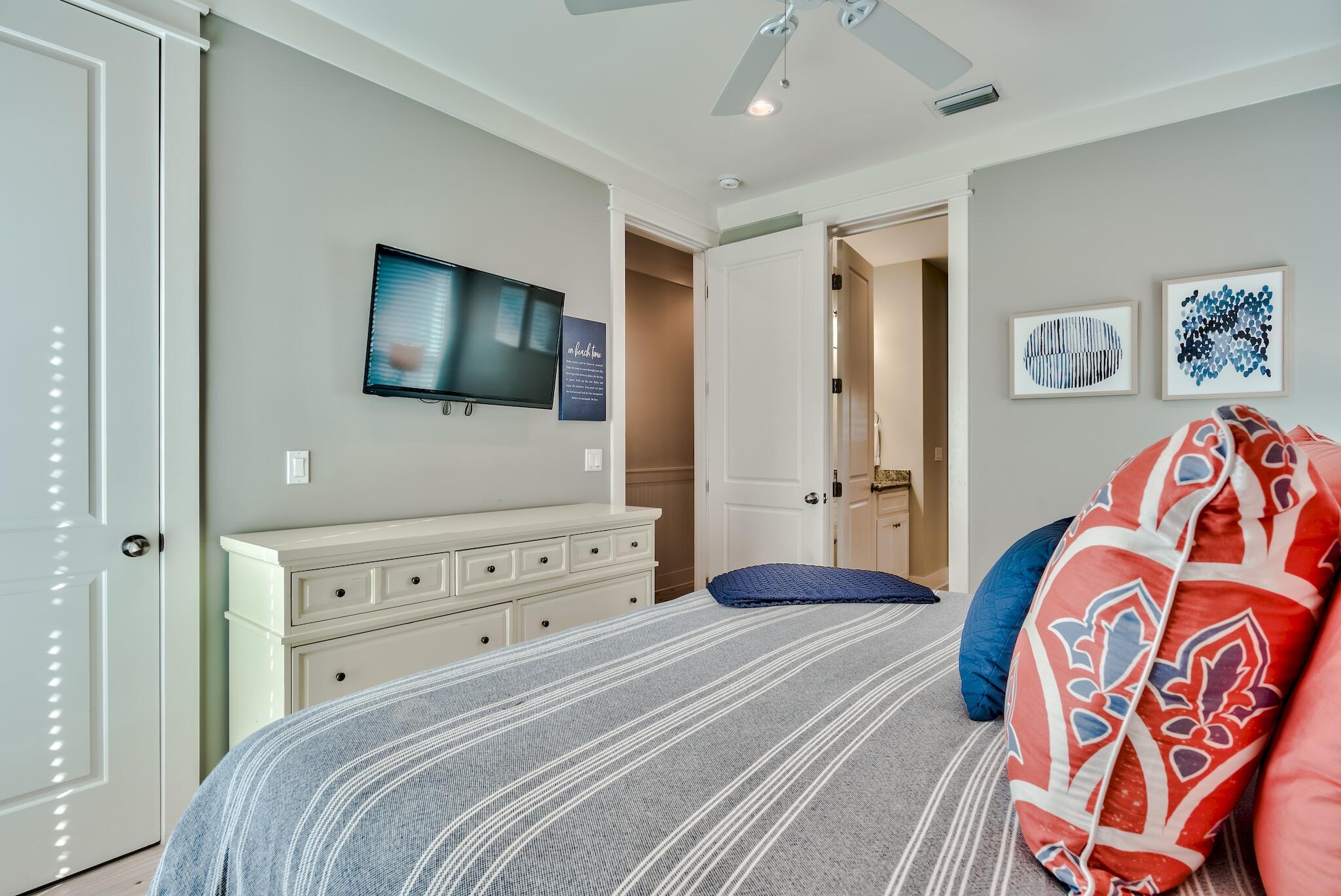 105 Blue Dolphin Loop Inlet Beach, FL 32461 - Photo 17 of 42 a bedroom with a bed and a flat screen tv