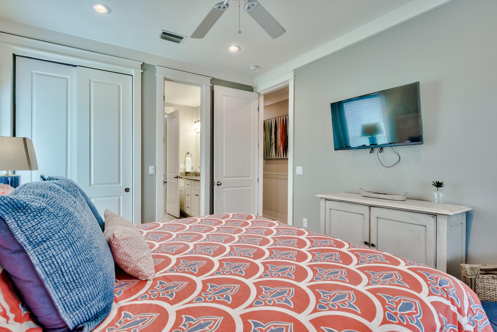 105 Blue Dolphin Loop Inlet Beach, FL 32461 - Photo 20 of 42 a bedroom with a bed and a flat screen tv