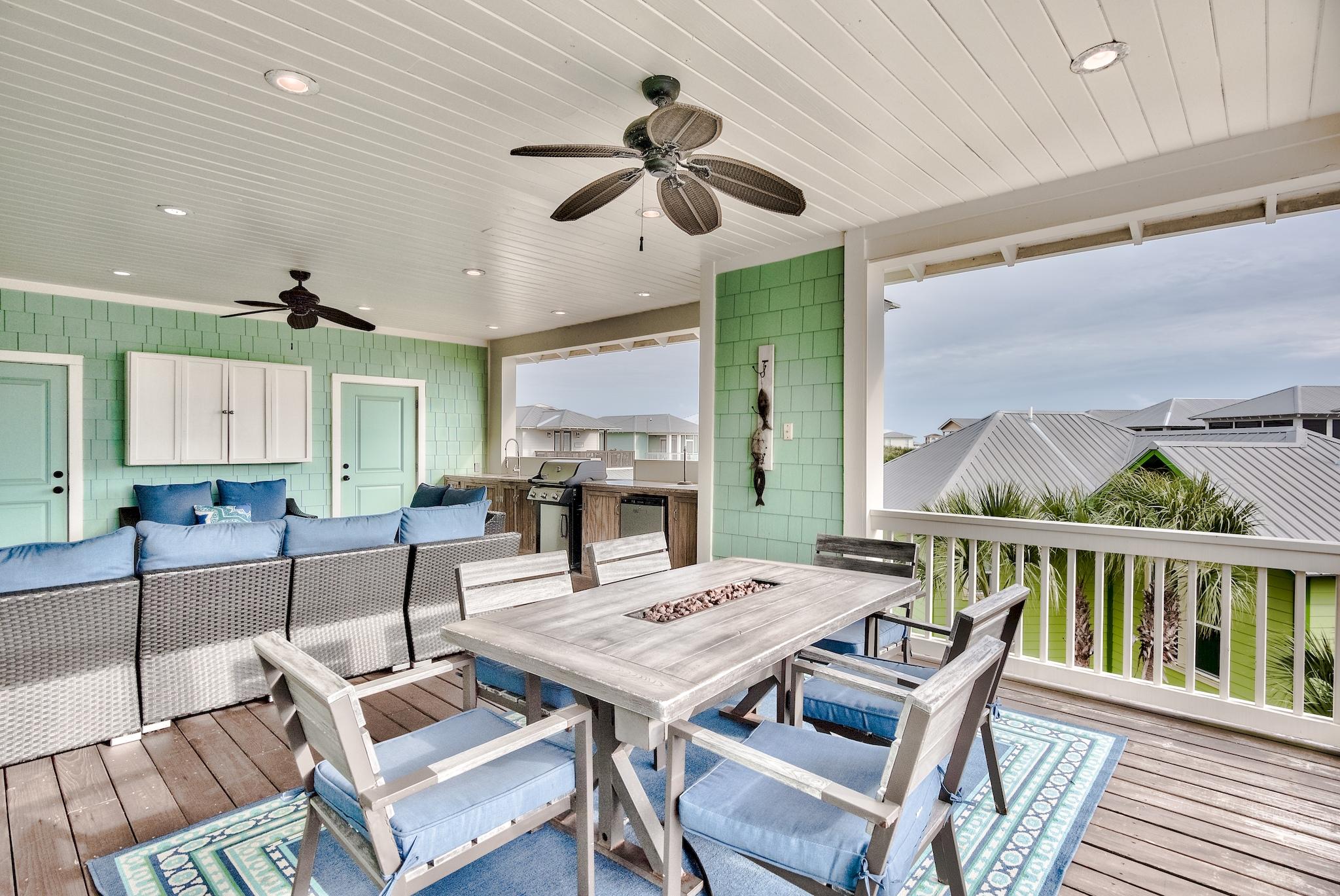105 Blue Dolphin Loop Inlet Beach, FL 32461 - Photo 29 of 42 a living room with furniture a rug and a chandelier