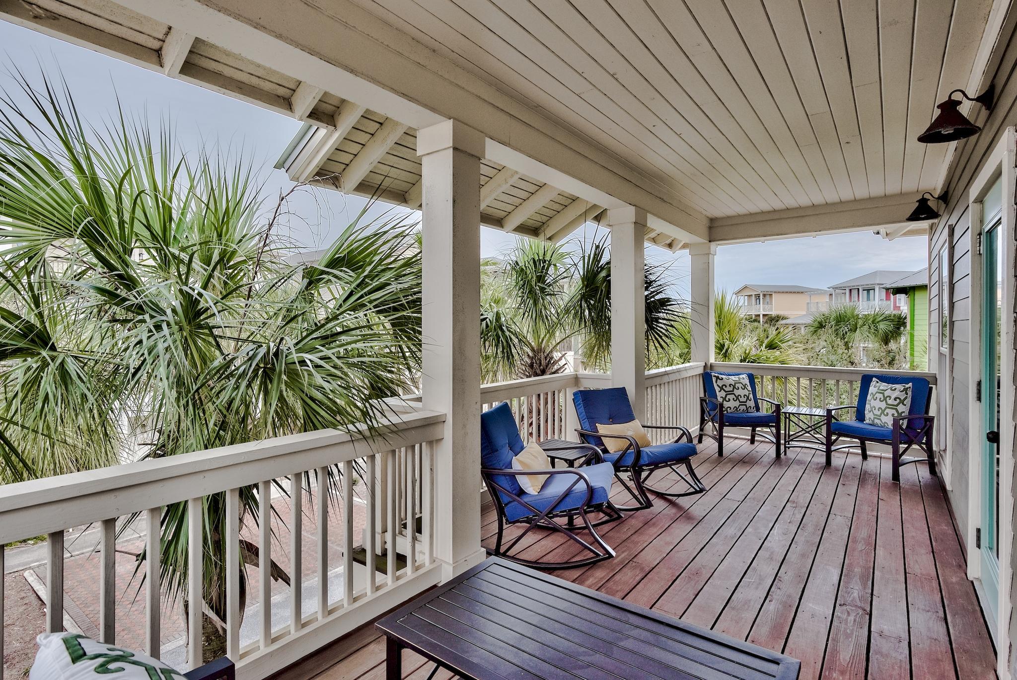 105 Blue Dolphin Loop Inlet Beach, FL 32461 - Photo 32 of 42 a view of balcony with chairs and wooden floor