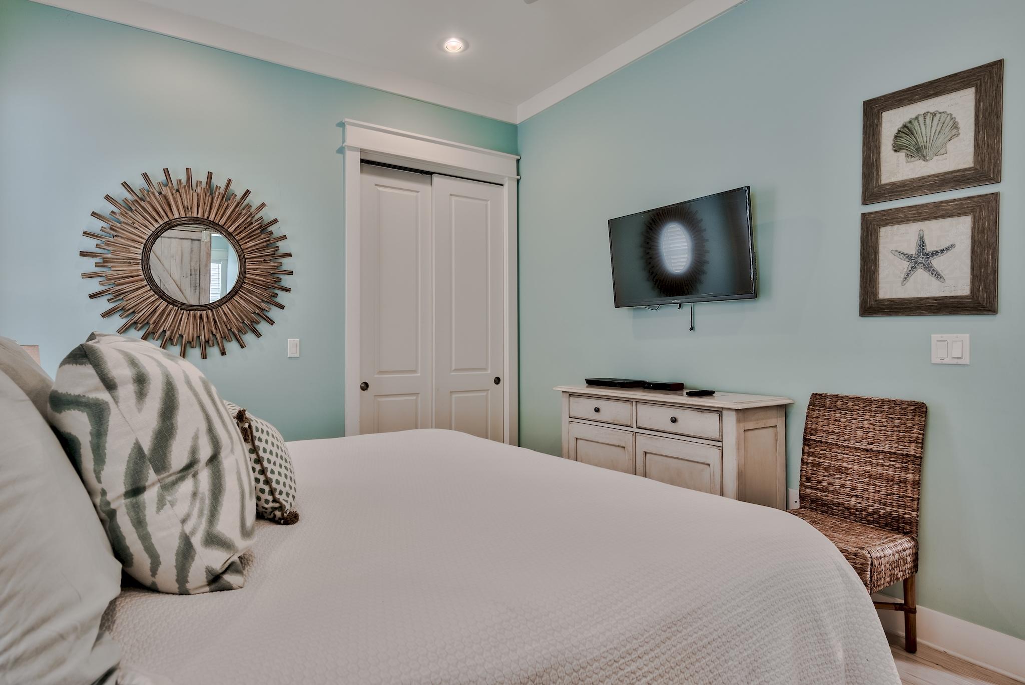 105 Blue Dolphin Loop Inlet Beach, FL 32461 - Photo 40 of 42 a bedroom with a bed and a flat screen tv