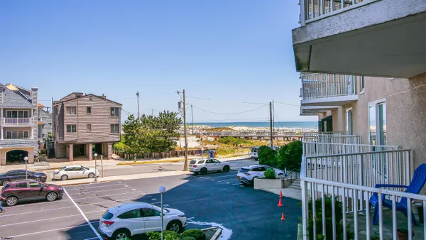 a living room with furniture and a gym