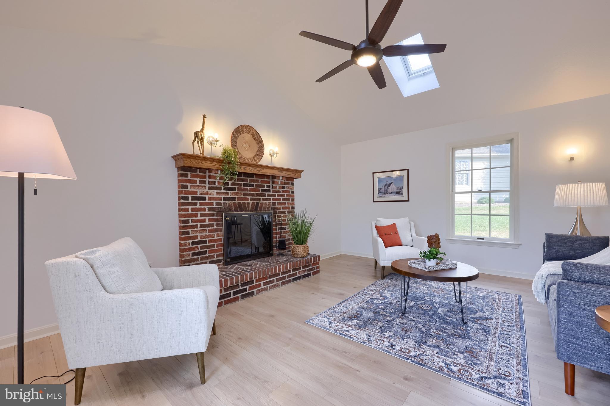1 Brookwood Drive Lititz, PA 17543 - Photo 21 of 42 a living room with furniture a rug and a fireplace