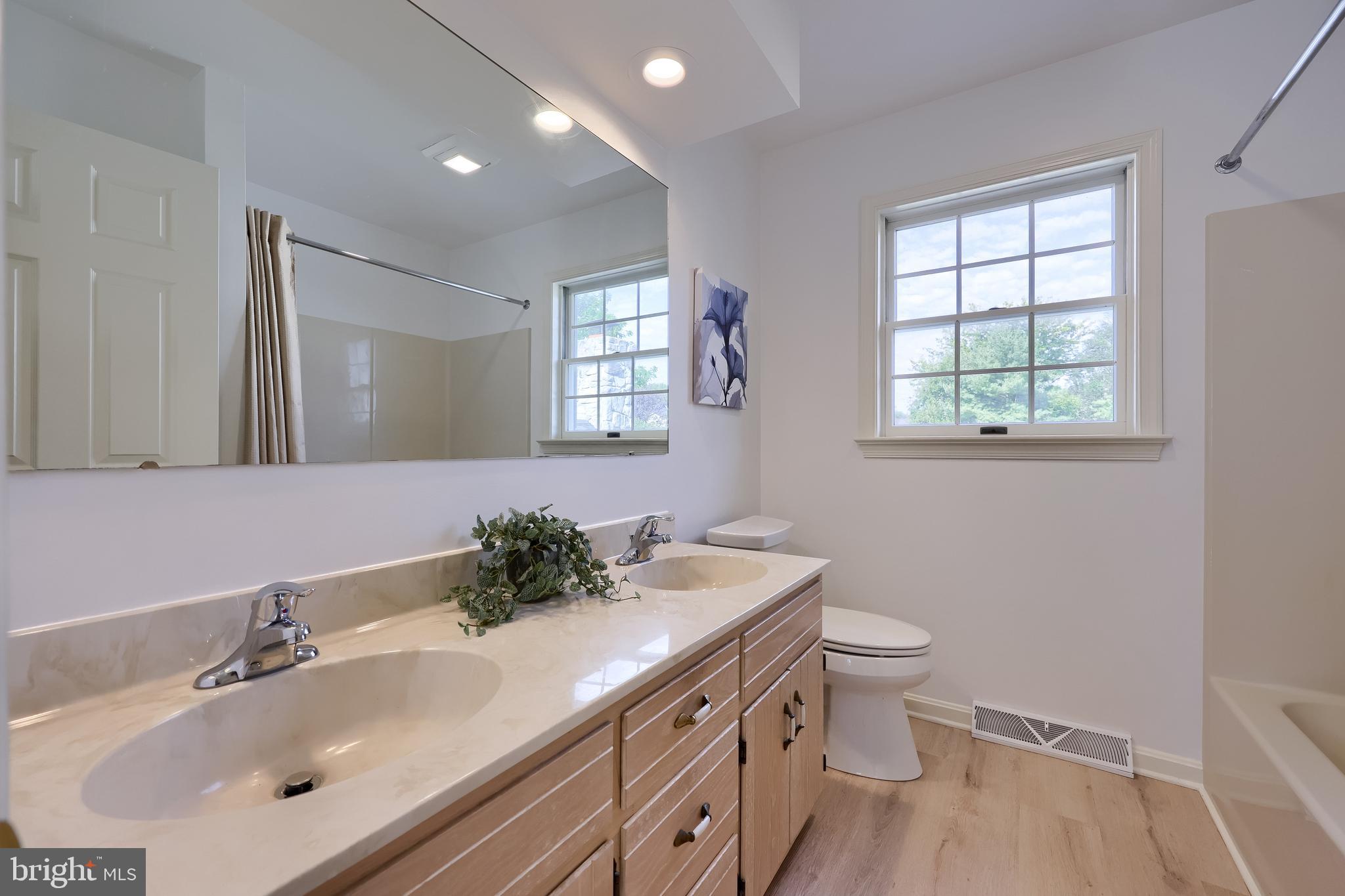 1 Brookwood Drive Lititz, PA 17543 - Photo 29 of 42 a bathroom with a sink toilet and mirror