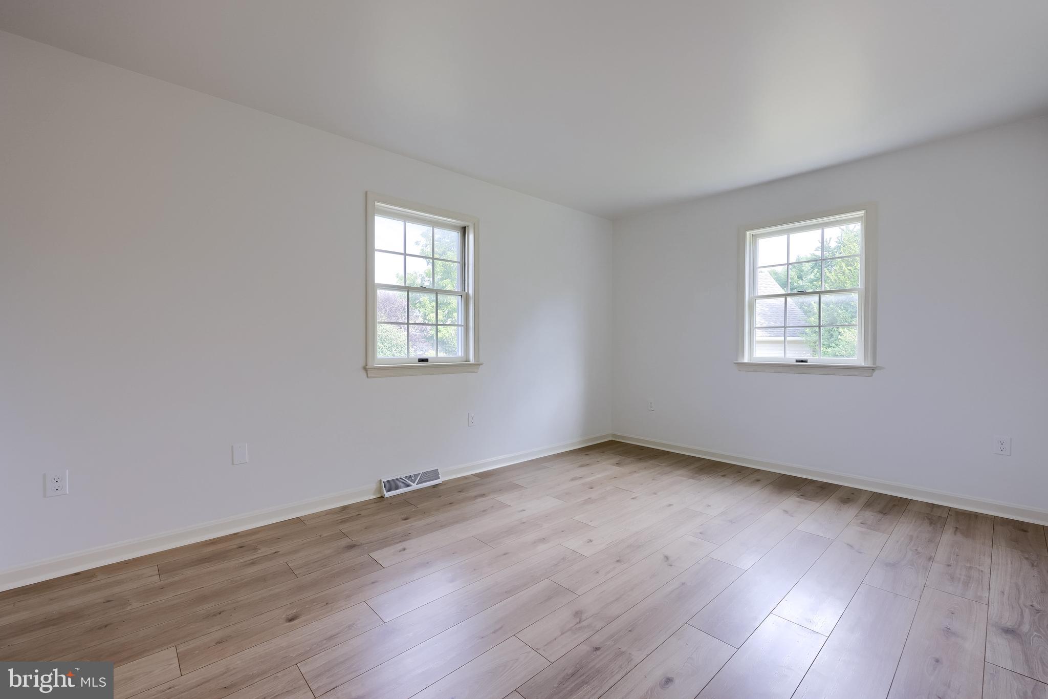 1 Brookwood Drive Lititz, PA 17543 - Photo 34 of 42 an empty room with wooden floor and windows