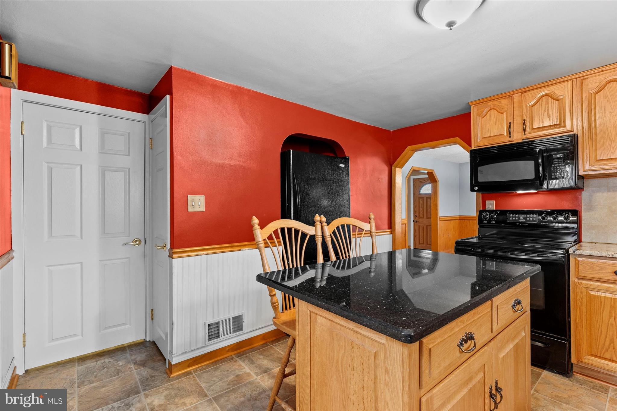 2279 Manor Road York, PA 17408 - Photo 11 of 27 a kitchen with stainless steel appliances granite countertop a stove and a refrigerator