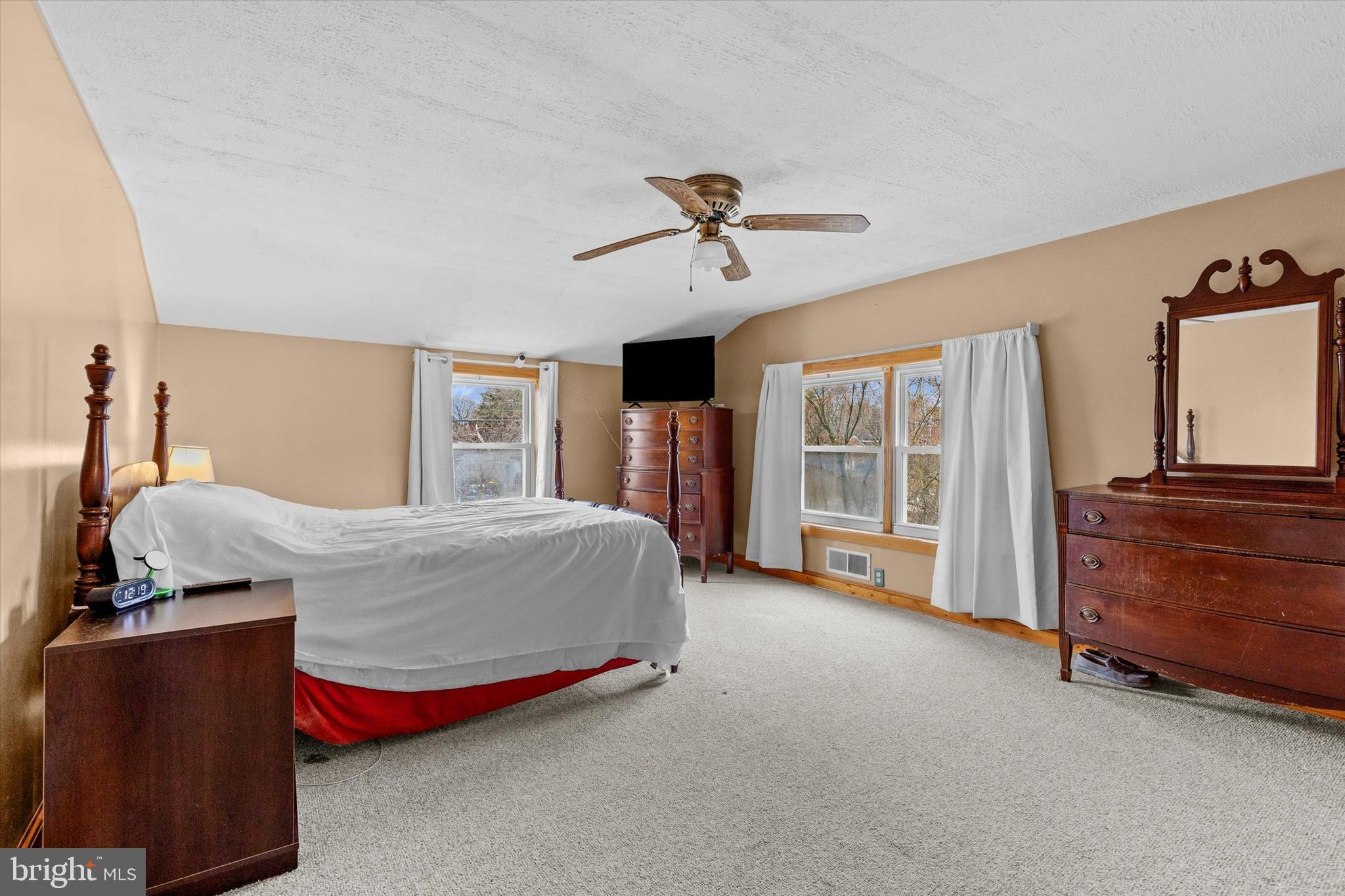 2279 Manor Road York, PA 17408 - Photo 15 of 27 a spacious bedroom with a bed and a dresser