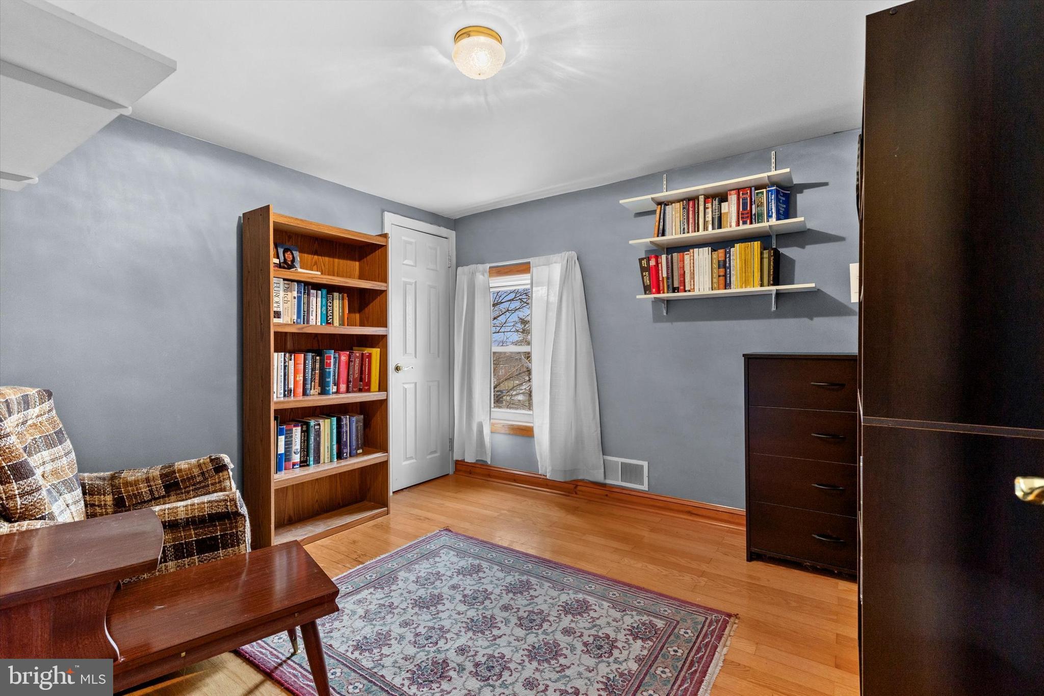 2279 Manor Road York, PA 17408 - Photo 17 of 27 a living room with a bookshelf and a book shelf