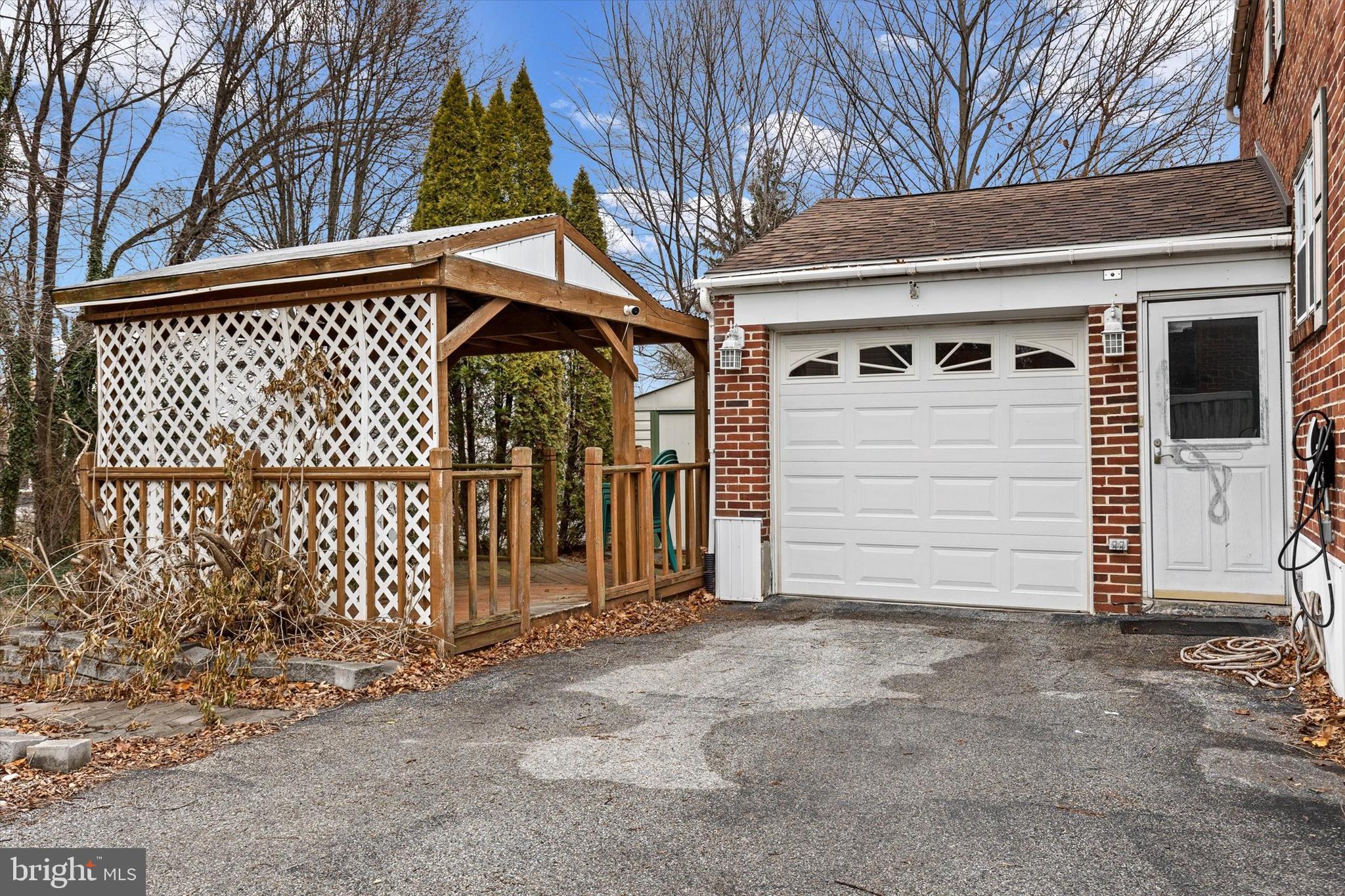 2279 Manor Road York, PA 17408 - Photo 22 of 27 a front view of a house with a garage