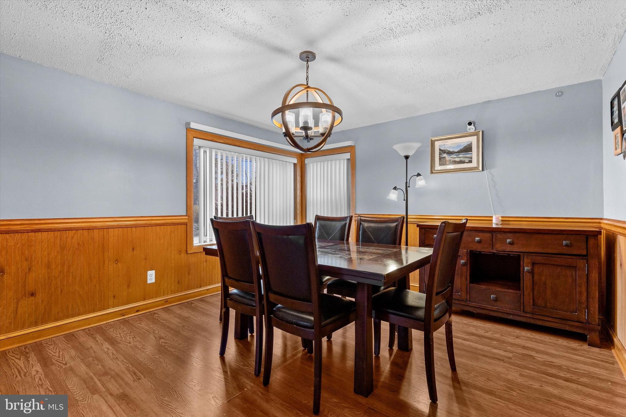 2279 Manor Road York, PA 17408 - Photo 8 of 27 a view of a dining room with furniture window and wooden floor