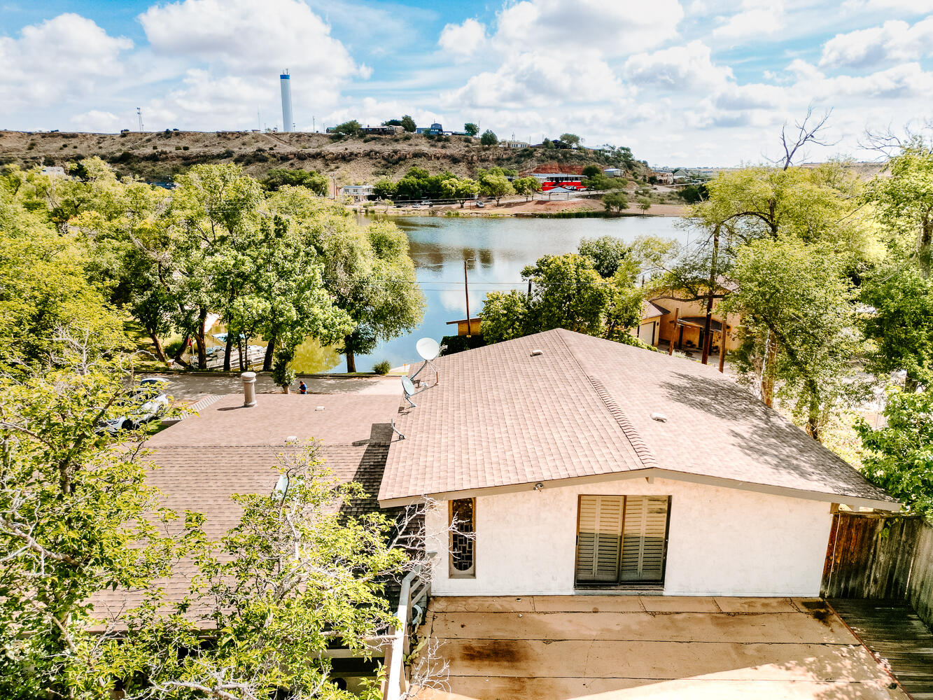 585 Comanche Drive Lubbock, TX 79404 - Photo 12 of 17 a aerial view of a house with a lake view