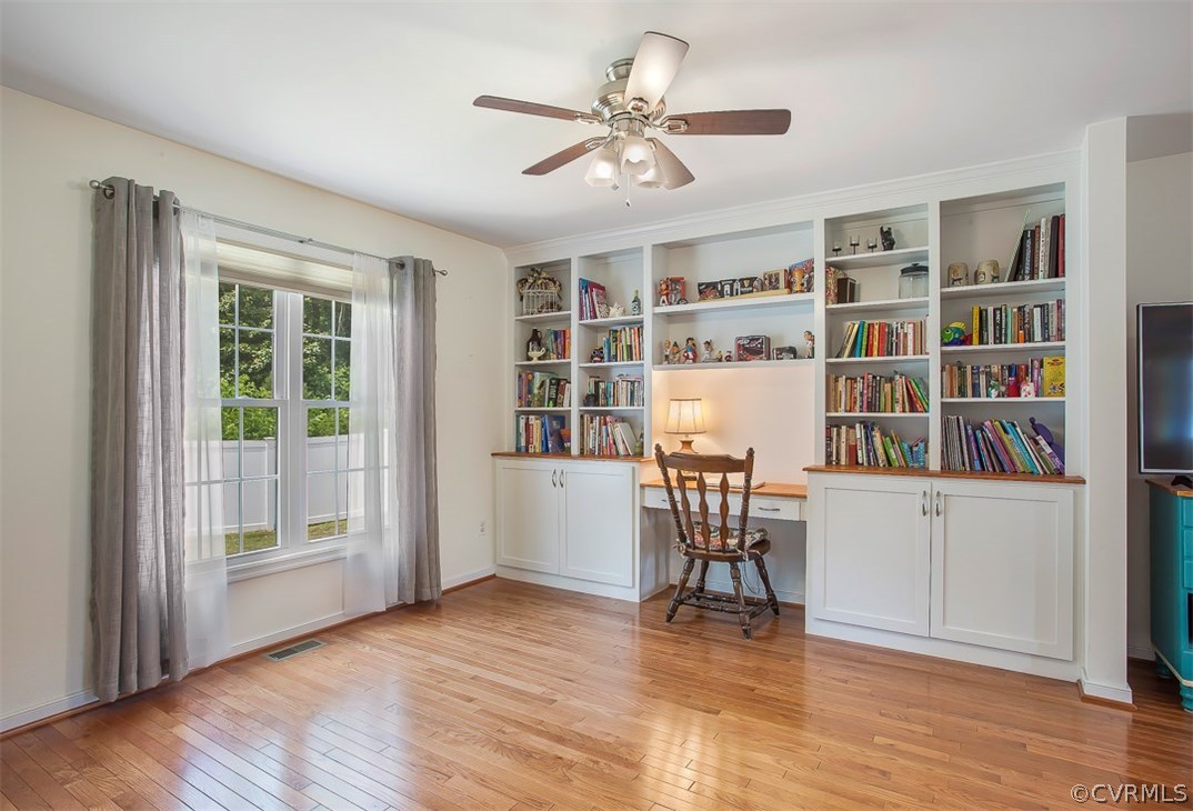 10724 Ethens Mill Road Chester, VA 23831 - Photo 11 of 27 a view of a livingroom with furniture and a bookshelf