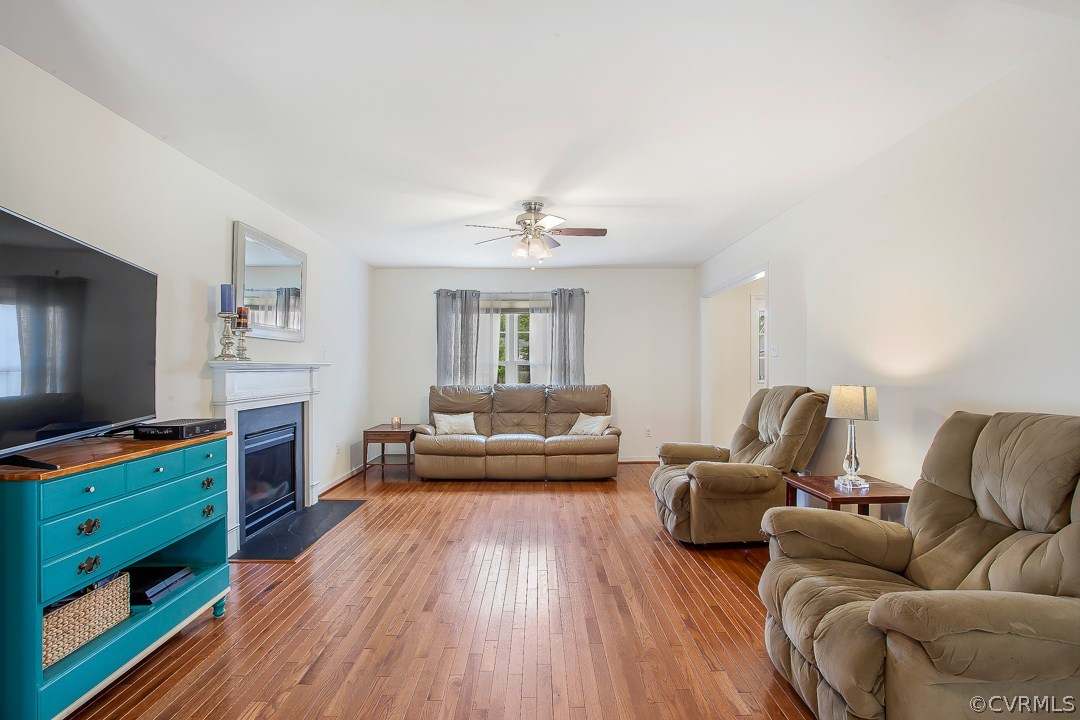 10724 Ethens Mill Road Chester, VA 23831 - Photo 12 of 27 a living room with furniture and a flat screen tv