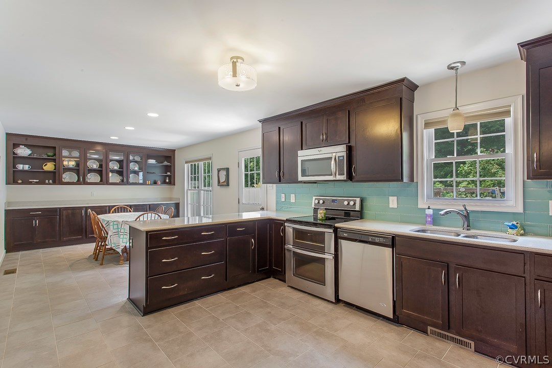 10724 Ethens Mill Road Chester, VA 23831 - Photo 13 of 27 a kitchen with a sink and cabinets