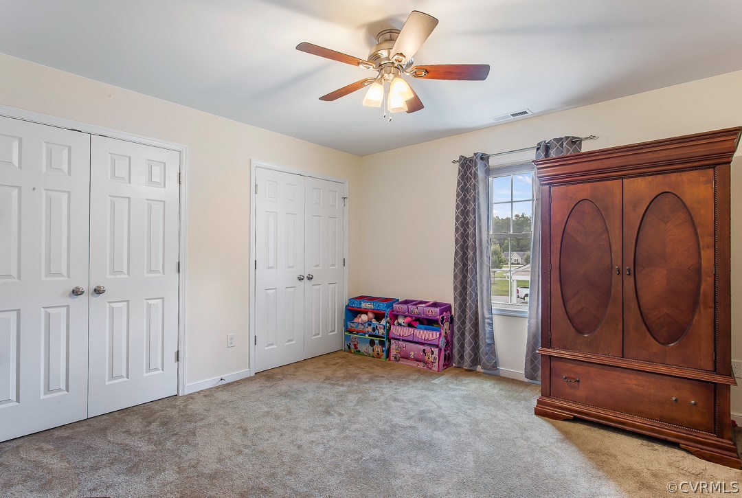 10724 Ethens Mill Road Chester, VA 23831 - Photo 18 of 27 a view of room with furniture and a chandelier fan