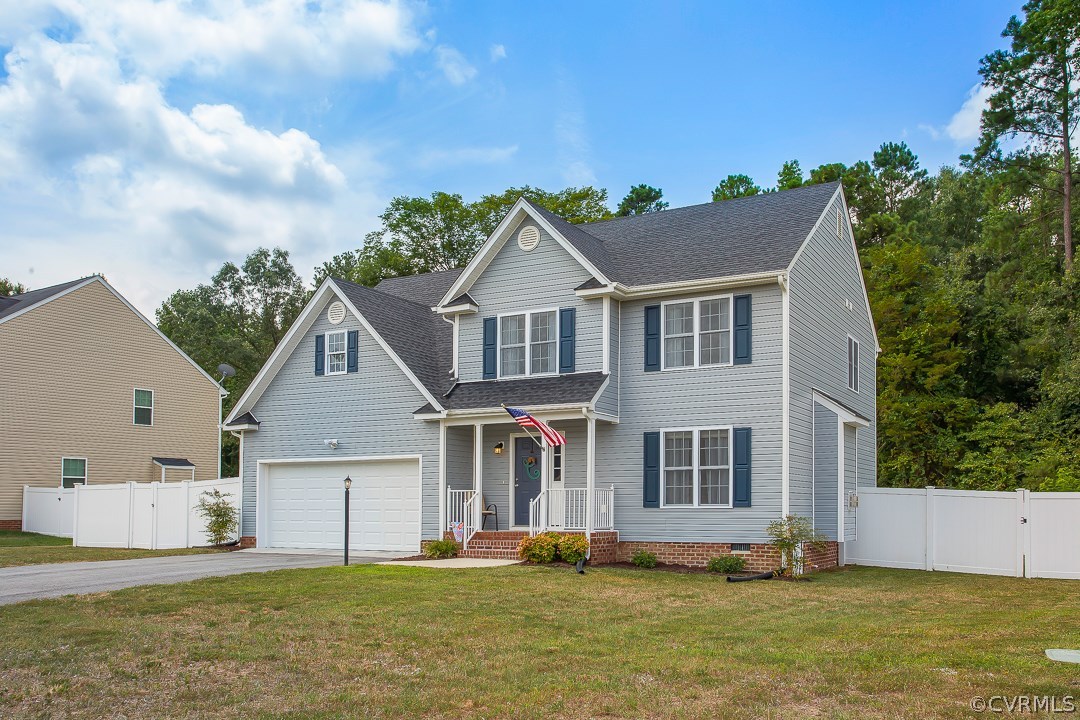 10724 Ethens Mill Road Chester, VA 23831 - Photo 2 of 27 a front view of a house with a yard