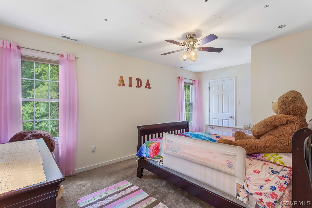 10724 Ethens Mill Road Chester, VA 23831 - Photo 21 of 27 a bedroom with a bed and a window