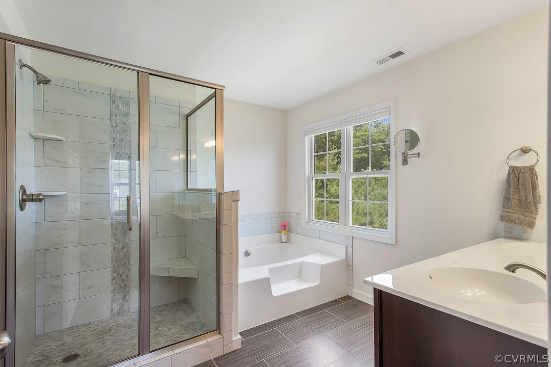 10724 Ethens Mill Road Chester, VA 23831 - Photo 26 of 27 a bathroom with a tub sink and shower