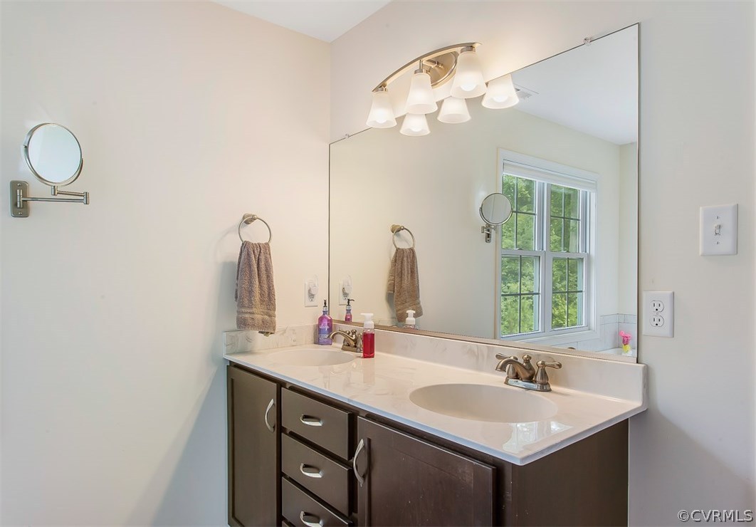 10724 Ethens Mill Road Chester, VA 23831 - Photo 27 of 27 a bathroom with a sink and a mirror