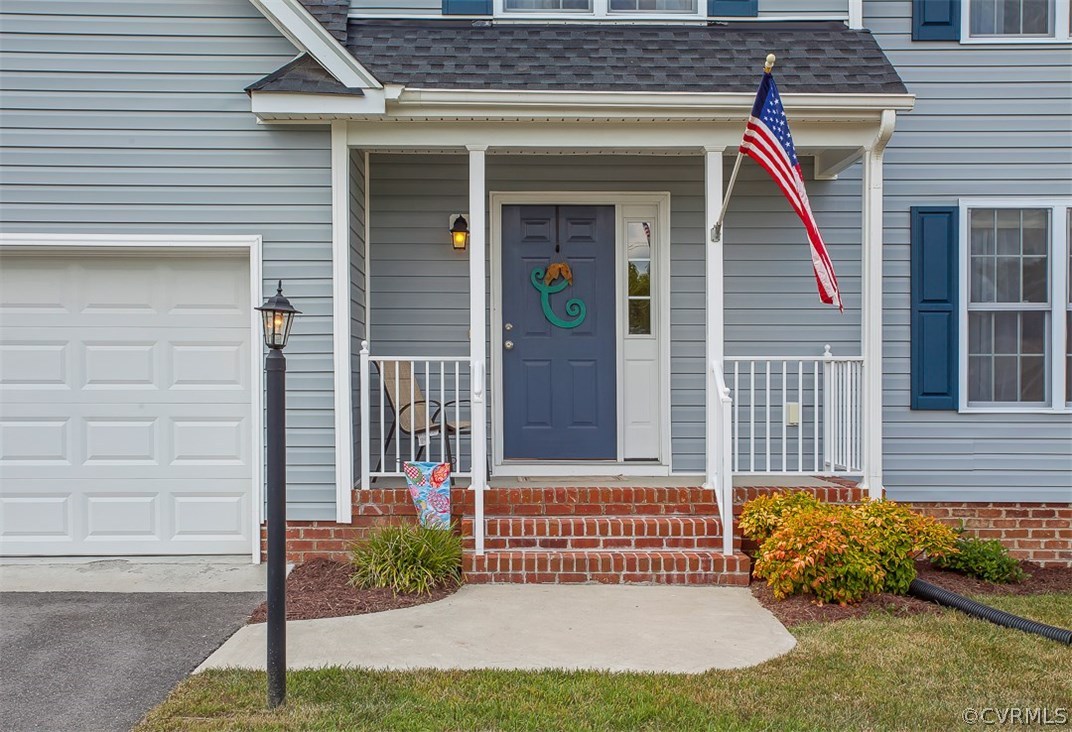 10724 Ethens Mill Road Chester, VA 23831 - Photo 3 of 27 a front view of a house with garden