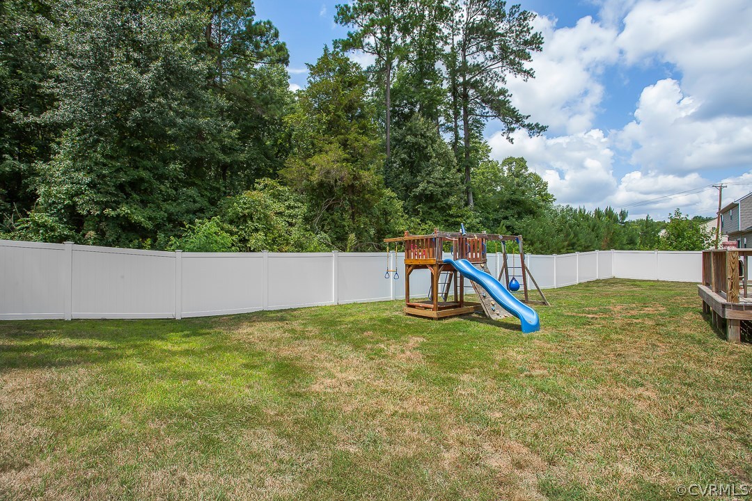 10724 Ethens Mill Road Chester, VA 23831 - Photo 5 of 27 a view of a swimming pool with a bench in the background
