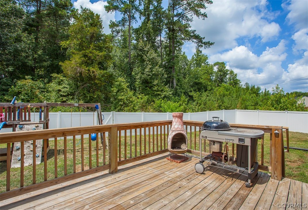 10724 Ethens Mill Road Chester, VA 23831 - Photo 6 of 27 a view of a deck with wooden floor and fence