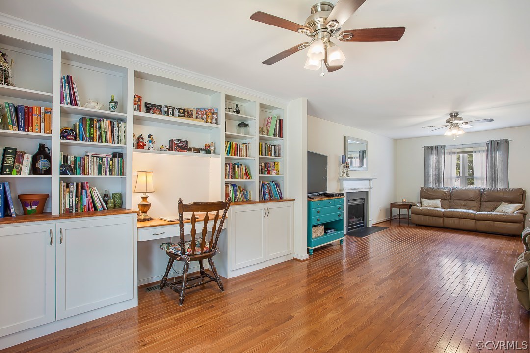10724 Ethens Mill Road Chester, VA 23831 - Photo 10 of 27 a living room with furniture and a book shelf