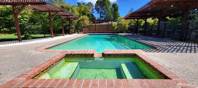 a view of yard with swimming pool
