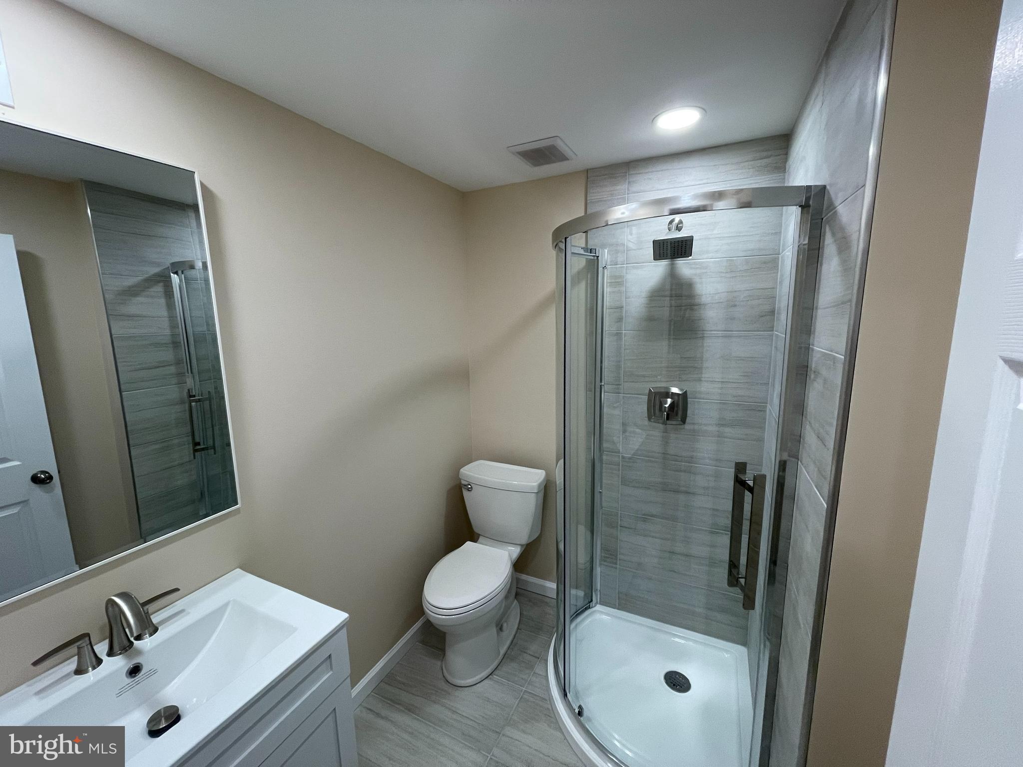 10924 Modena Place Philadelphia, PA 19154 - Photo 2 of 6 a bathroom with a granite countertop sink toilet and shower